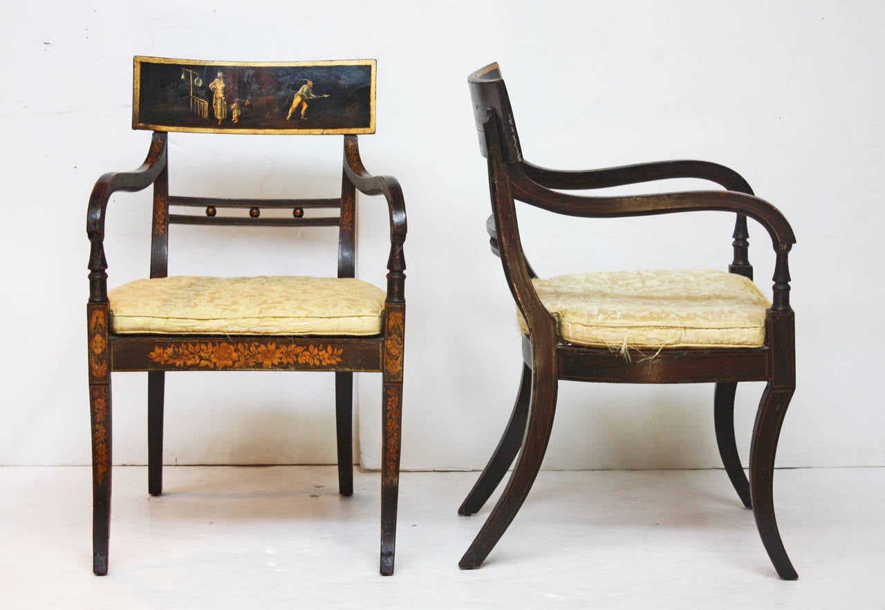 pair of period English Regency chairs with cane seats, ebonized frames with gilt and Chinoiserie decoration, saber legs, well worn silk cushions, seat height is 16" H without the cushions, 17" H with

$5,650.00 