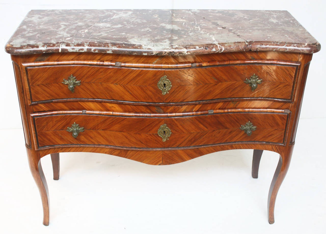 a circa 1750, Louis XV commode stamped IDUBOIS (several times) and JME (at least 5 times), the piece has a  serpentine front with  2 drawers, herringbone inlays and a period marble top 

Important French ébéniste Jacques Dubois 1694 - 1763,