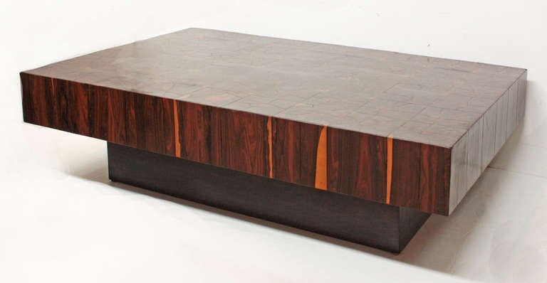 a chunky low-profile platform coffee table with oystered rosewood veneers in 6.5