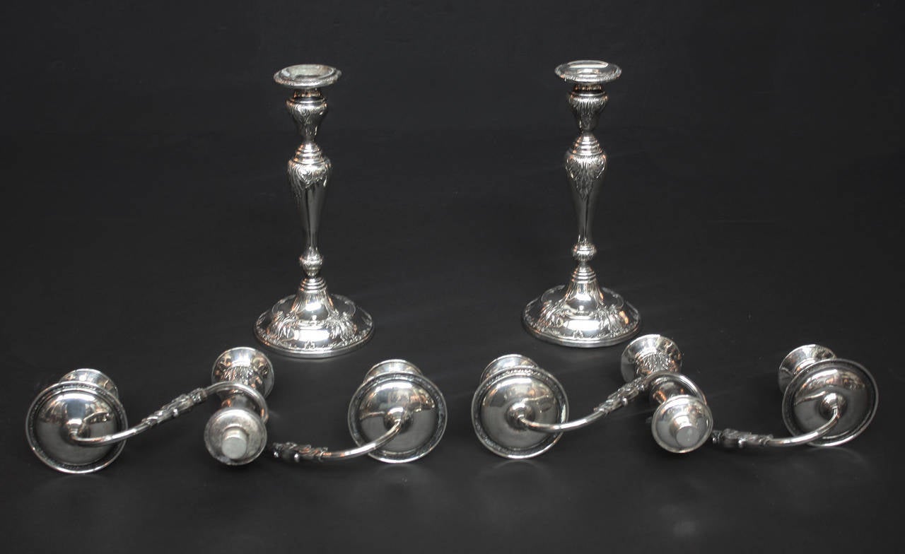 Elegant pair of Frank M. Whiting weighted sterling silver candelabra. The three (3) light tops can be removed and converted to two (2) single candle stick holders. Stamped: Sterling by Frank M. Whiting & Co., logo, weighted and re-enforced, 2069 See