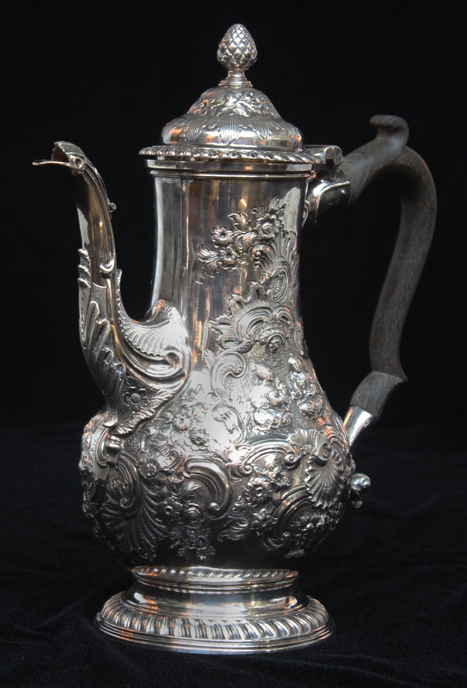 A spectacular and uncommon hallmarked sterling silver Georgian coffee pot with ebony handle and chinoiserie repousse' overall decoration. Coffee pot is by: Benjamin Gignac. Silversmith marks for Gignac are below the lid (see image 5)
The coffee pot