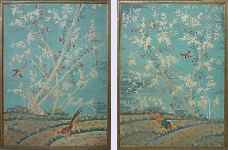 a large pair of painted wallpaper panels, sky blue ground with graceful bamboo and colorful birds.