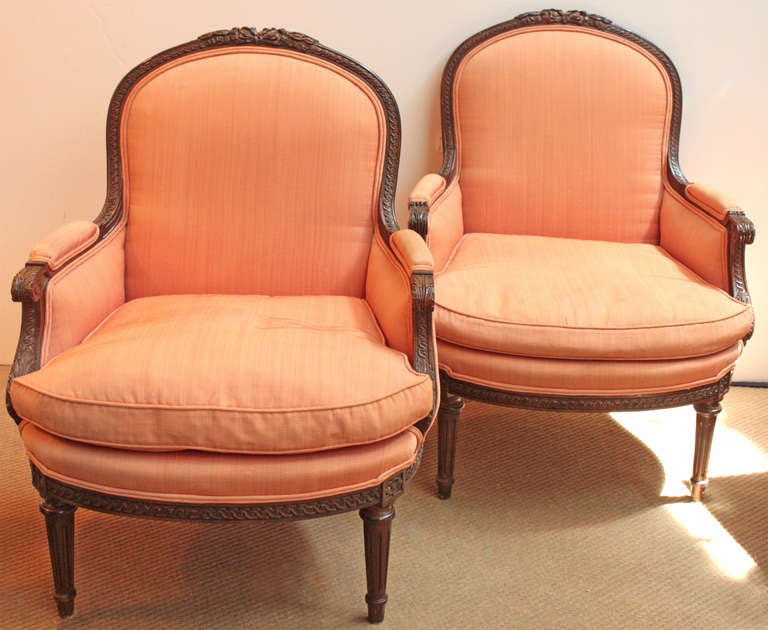 a pair of upholstered chairs (peach / salmon silk faille) with carved fruitwood frames by MGM / Meyer Gunther Martini, Louis XVI style