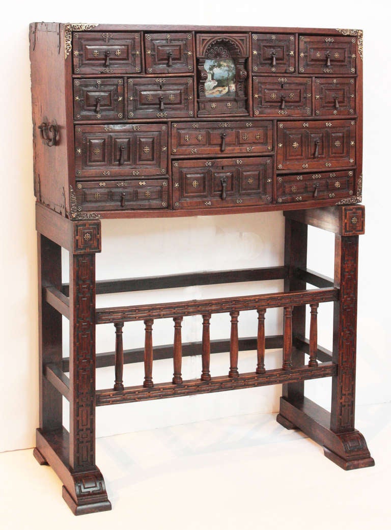 a wonderful Spanish vargueno on stand, walnut with gilt metal decorations and iron handles, with working key