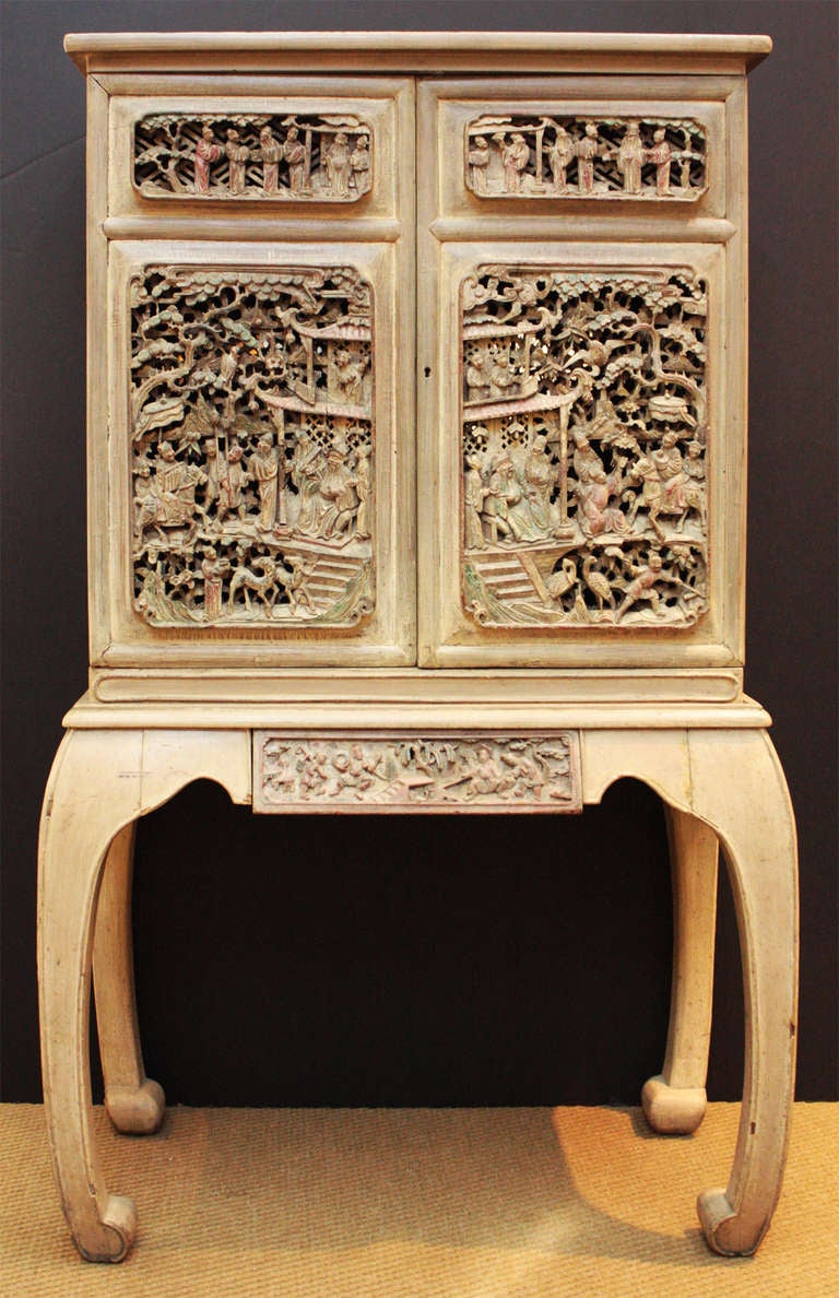 a modern (20th century) pickled / whitewashed cabinet made to accomodate heavily carved, pierced Chinese doors and drawer (19th century), curving legs with block feet

made for shelves, either glass of wood, none included (as found)

the back of