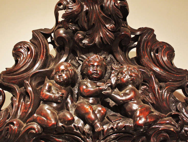 Unknown Large Oval Mirror with Carved Putti