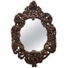 Large Oval Mirror with Carved Putti