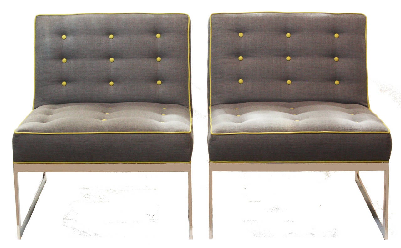 a pair of Schilt armless chairs on metal bases. Upholstered in grey trimmed in lime