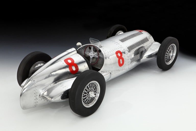 A magnificent and unique, large-scale aluminium sculptural model of the highly successful 1937 Mercedes-Benz W125. The body, constructed in Elwell’s signature style of hand formed aluminium panels riveted over a space frame, with cast wheels and