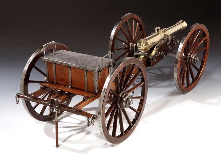 LEPIED, 1836: A magnificent ‘working scale’ model of a field cannon and ammunition box, circa 1936, the polished bronze barrel marked LEPIED 1836, the large diameter wooden wheels with polished iron rims, ammo box with hinged iron cover, and bronze