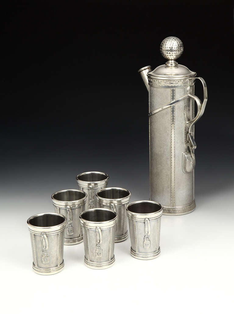 Make your cocktail hour go with a swing with this rare 1926 silver-plated novelty cocktail set, comprising Golf Bag shaker with simulated straps and stitching, and six cups ensuite. 

George H. Berrys winning design for the Derby Plate Silver