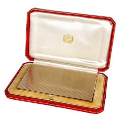 Gold cigarette case by Cartier, London.