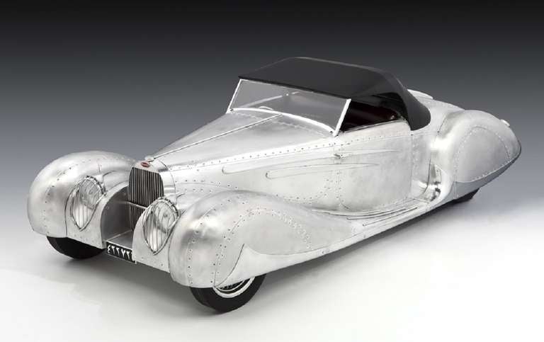 A magnificent and unique, hand-built sculptural model of the 1939 supercharged Bugatti, which was presented to Mohammed Reza Pahlavi, the Prince of Persia and future Shah of Iran, in 1939. 

This model, taking over 1000 hours to create, is