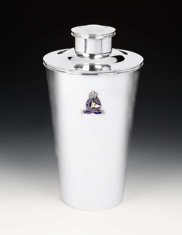 A very large and impressive Sterling silver cocktail shaker of Modernist form, by the Danish silversmiths Anton Michelsen, the large tapered body featuring the silver and enameled crest to the front of the Danish Yacht Club, the insignia reading