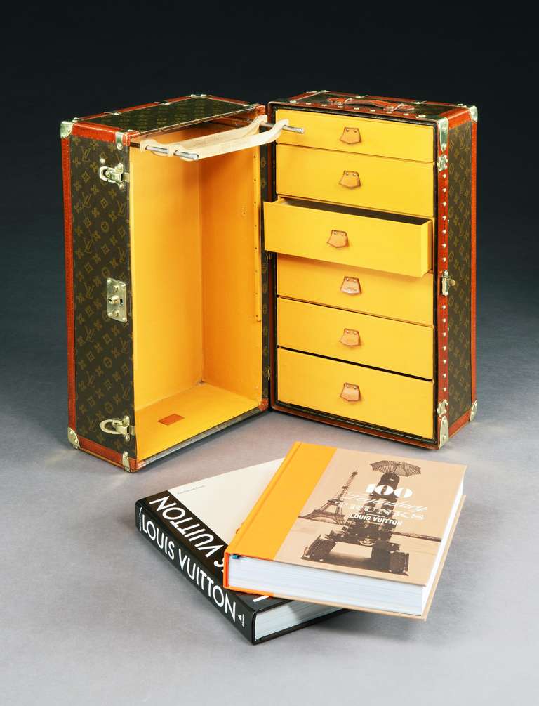 Louis Vuitton, Paris: a magnificent and super-rare miniature ‘Malle Armoire’ (wardrobe trunk), presumably made as a salesman’s sample to show clients of Vuitton how the armoires could be configured when they placed an order. 

The trunk, correct