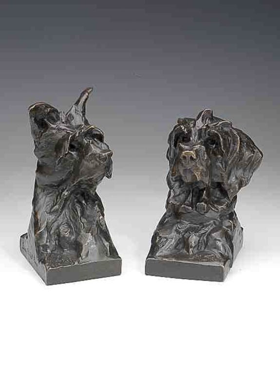 A superb pair of bronze bookends depicting West Highland terriers in different poses, exquisitely cast using the cire perdue (lost wax) process, signed by the sculptor and bearing the foundry mark for the eminent foundry Susse Frères, Paris.