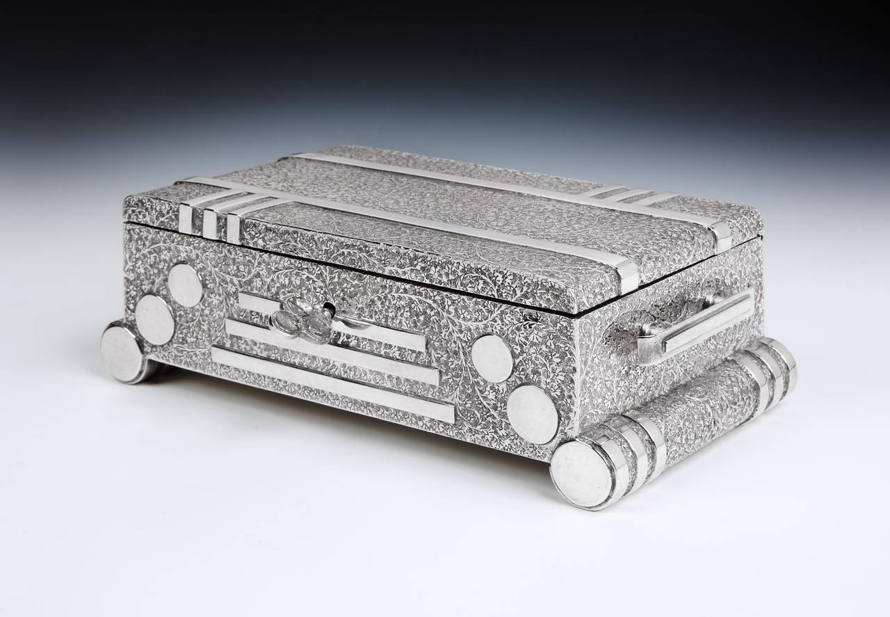 A superb and very stylish Art Deco sterling silver cigarette or trinket box in the form of a 1930s radio set, with profuse foliate moulding to the body broken by highly polished line details to all five visible sides. The front simulating polished