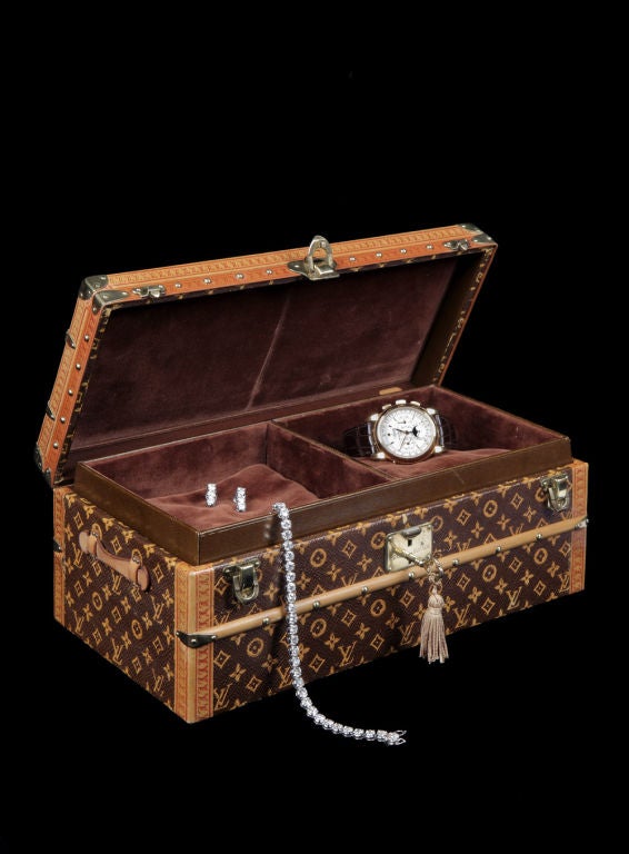 An exceptionally rare Malle Fleurs (Flower Trunk), a miniature version of the classic courier trunk, covered in L. V. Monogramme fabric with leather handles and brass trim, the lock plate signed 