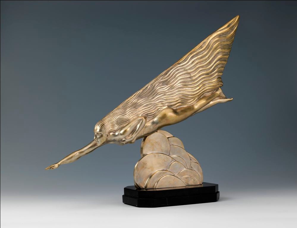 A silvered bronze sculpture depicting a streamlined female figure above stylised cloud shapes, on shaped marble base, impressed signature and ‘Etling Paris’. <br />
<br />
Literature: <br />
‘Art Deco and other Figures’, Chancery House, 1978,