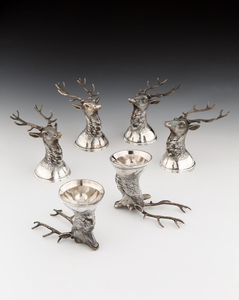A fine set of six Russian silver Stirrup cups modelled as stag’s heads with antlers, bearing Russian silver marks, 1897 – 1908.