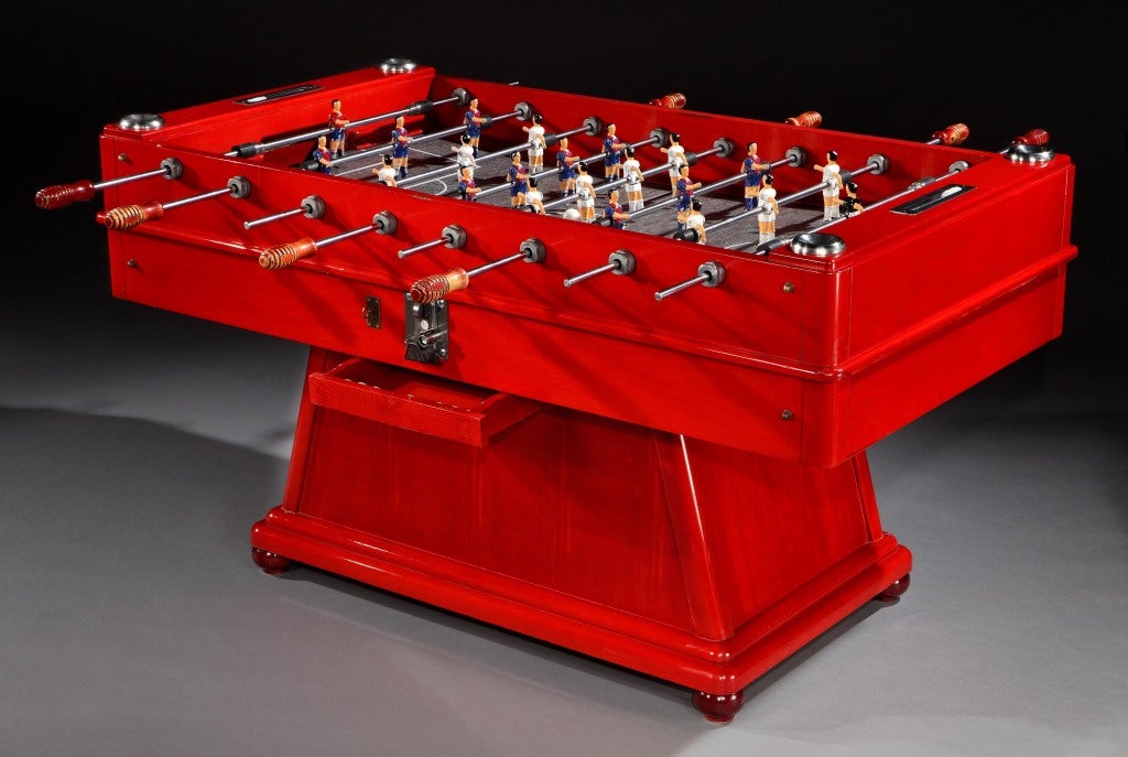 A wooden table football game by the Spanish maker Cordoba, circa 1960, fully refurbished and complete with painted alloy players, an abacus-type scoring system and footballs. Two great features of this type of table is the fact that the players are