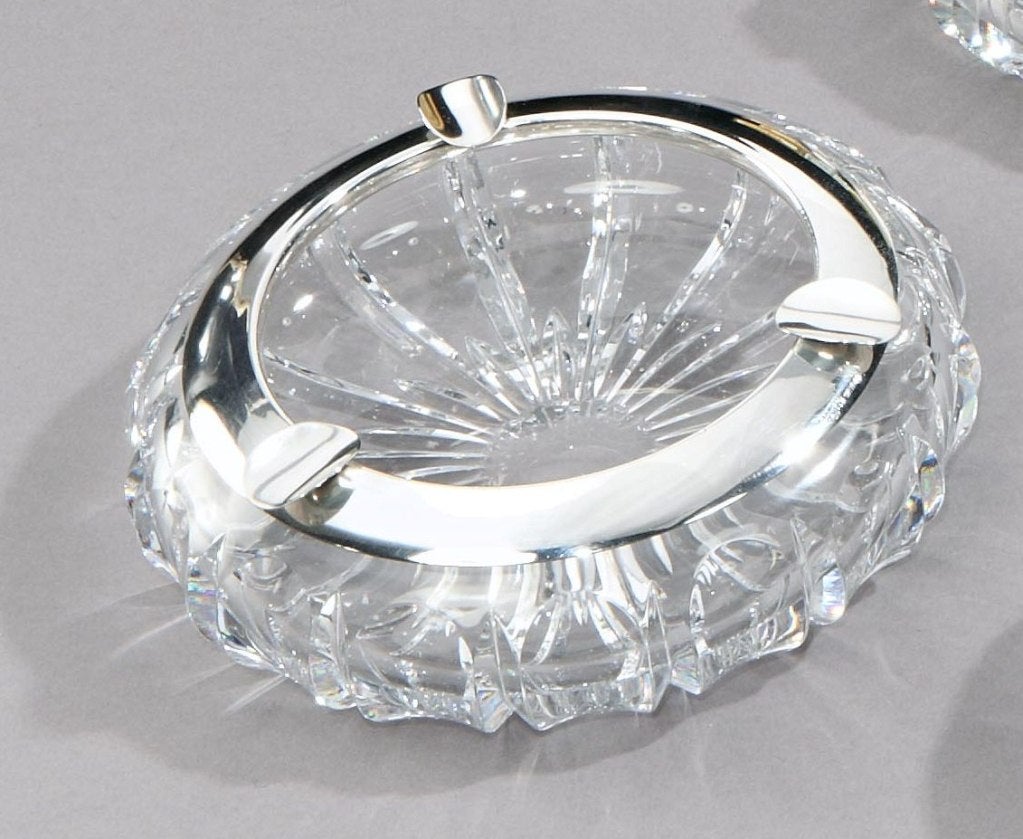 A large Sterling silver mounted crystal Art Deco cigar ashtray, with three shaped cigar rests and scalloped cut design to the sides, and star-burst cutting to the base.