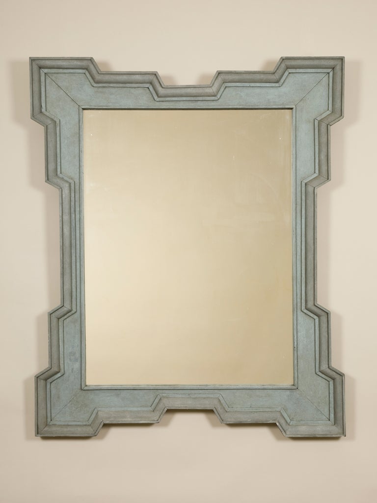 A 19th century rectangular Continental mirror with a broad painted stepped frame and a later plate.