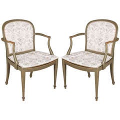 A Pair of Green Painted Elbow Chairs