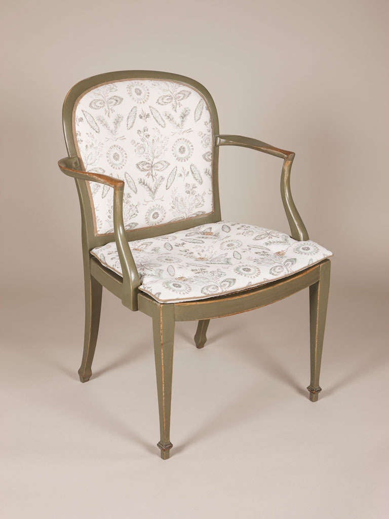 A Pair of Green Painted Elbow Chairs