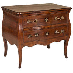 A 19th Century Cherrywood Bombe Commode