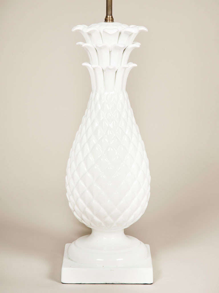 A pair of large white glazed pottery lamps in the form of pineapples, French circa 1950.