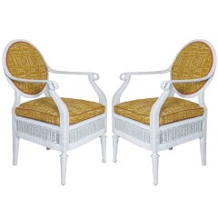 Pair of painted cane elbow chairs