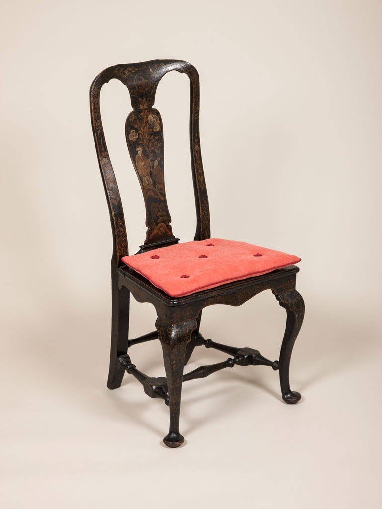 A pair of Queen Anne japanned side chairs with caned seats and cabriole legs, circa 1705.