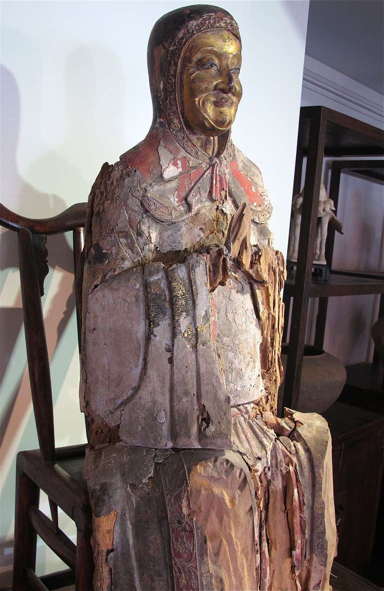 Painted and gilded sculpture of an European knight found in Northern China. 
Head portion with gilded face is in excellent conditional. The tarsal area once covered Torso area once consisted of layer of painted and gilded/ fabrics. With the