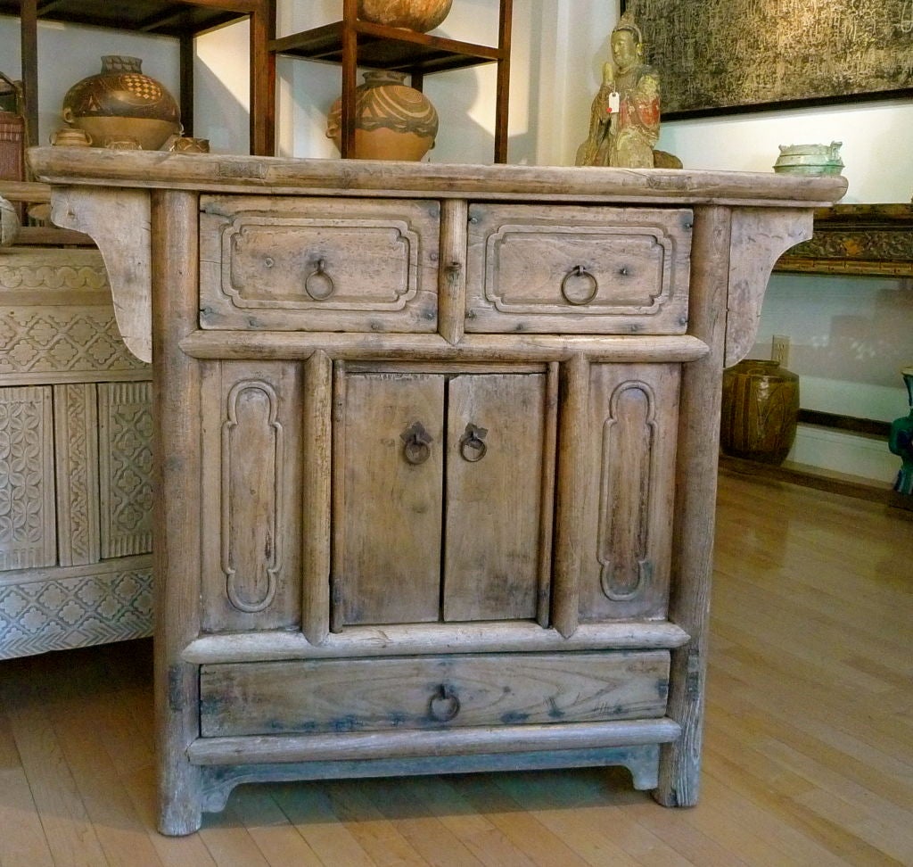 A weathered but solid cabinet from Northern China. Two drawers on top, pair of doors opening to a generous storage area 35