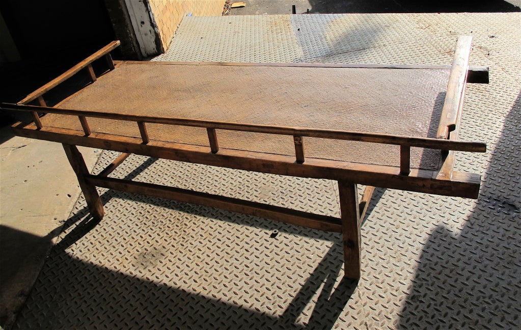 Day bed with elm wood frame and woven bamboo top. All original. Excellent condition.  A beautiful, one of a kind , coffee table.

Wonderful coffee table for both traditional or contemporary setting.