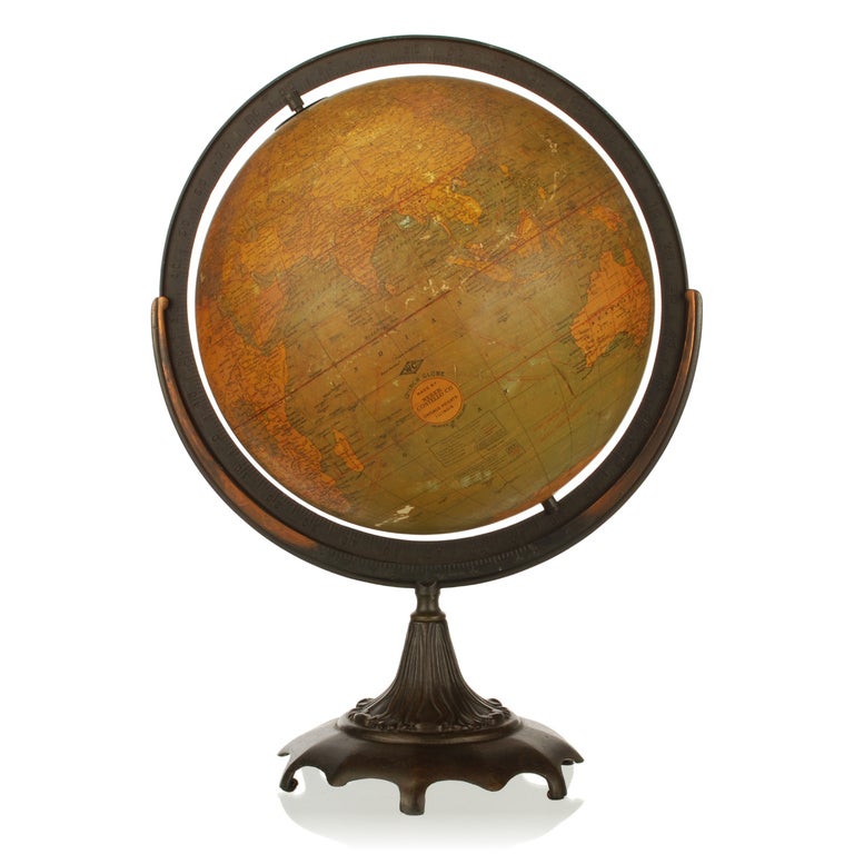 This is a very nice vintage 12 inch terrestrial globe made by Weber Costello Co. in Chicago Heights, Illinois, USA. The seas and oceans are a green golden tone, which makes this globe more striking than the average ones. It has a full ring meridian