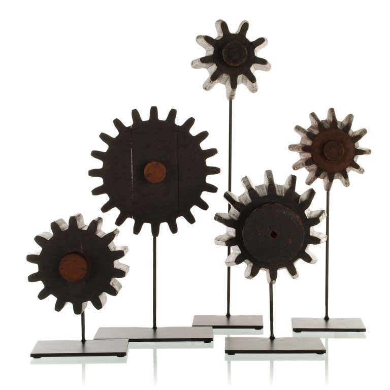 This is an exceptional collection of authentic antique foundry forms and patterns used to create various types of industrial gears. Dating from the early to mid 1900's, each of these machine age artifacts has been mounted on a custom made steel