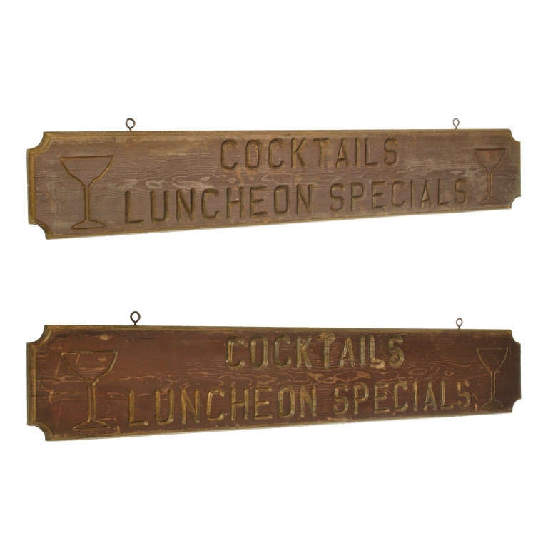 This vintage Cocktail sign is a double sided wood sign that once hung in a bar or lodge. It features a drink glass on each end with the words Cocktail and  Luncheon Special in between, all deeply carved into the wood. This is an authentic cocktail