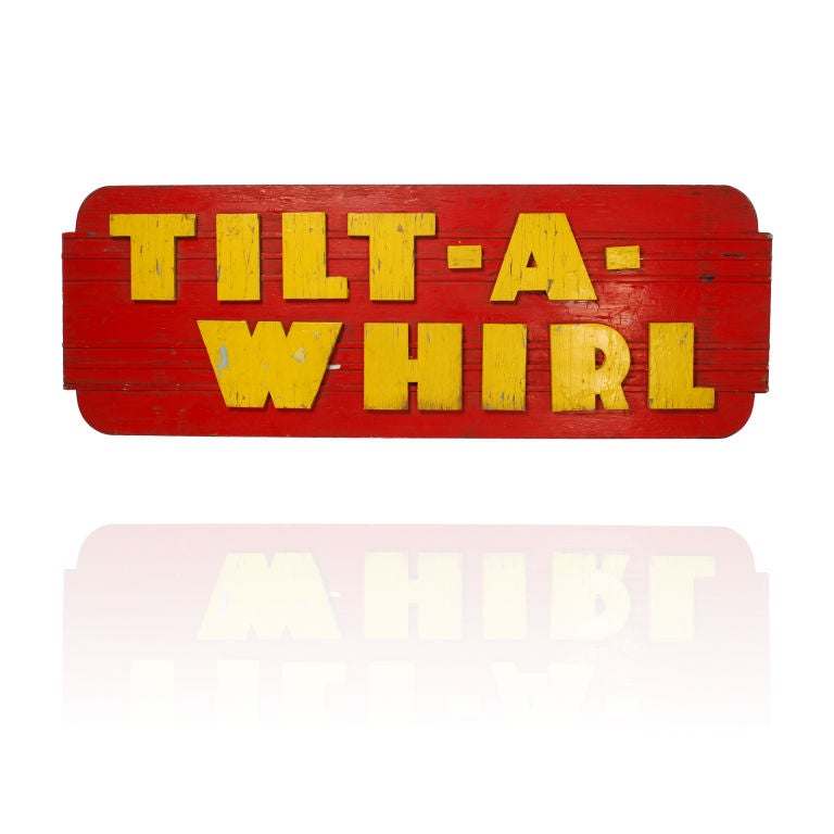 This is a large wood sign for the Tilt-A-Whirl Carnival Ride. The bold bright colors and the name say it all, what a great piece of vintage Americana. Hang it on a wall, use it as a bed headboard or put legs and a glass top on it for a really cool