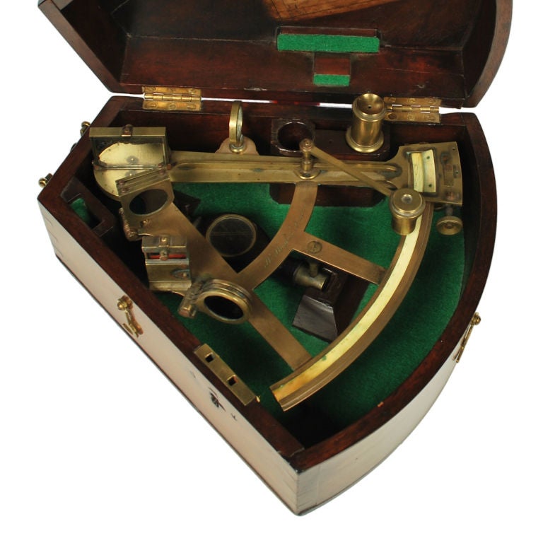 This is a wonderful antique brass Nautical Octant, signed H. Hughes of London and dates from around 1850. This exceptional instrument has an ivory scale, vernier, magnifier, 2 sets of colored filters, telescope and wood handle, with fitted mahogany