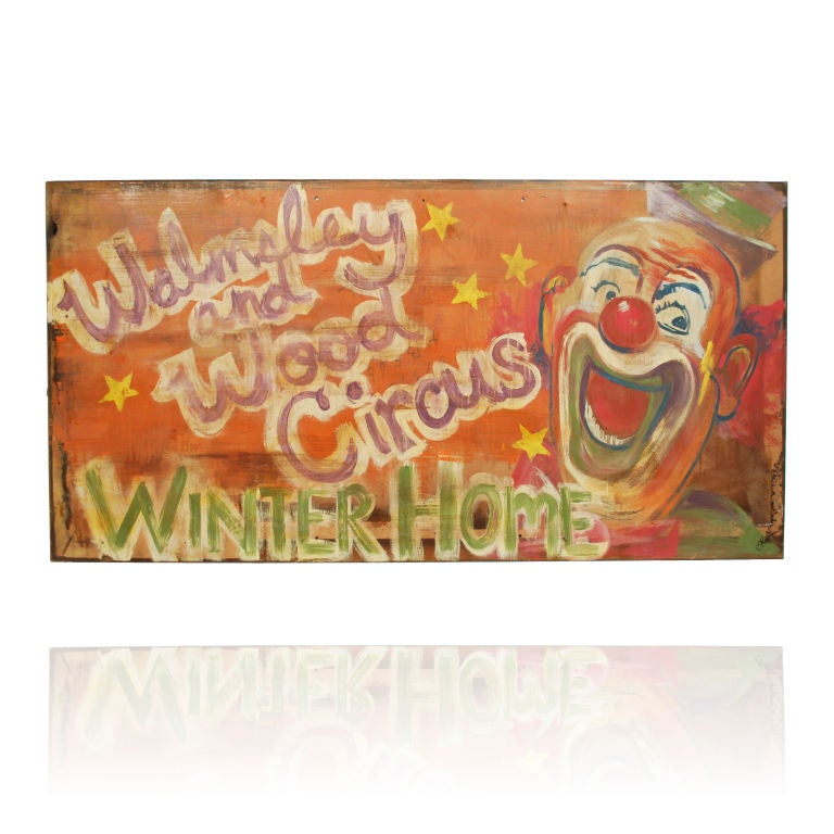 This large sign is from the Walmsley and Wood Circus and was most likely used as an entrance sign for their Winter home location. All hand painted, this colorful and joyous sign with its carnival style lettering and laughing Clown is a fine example