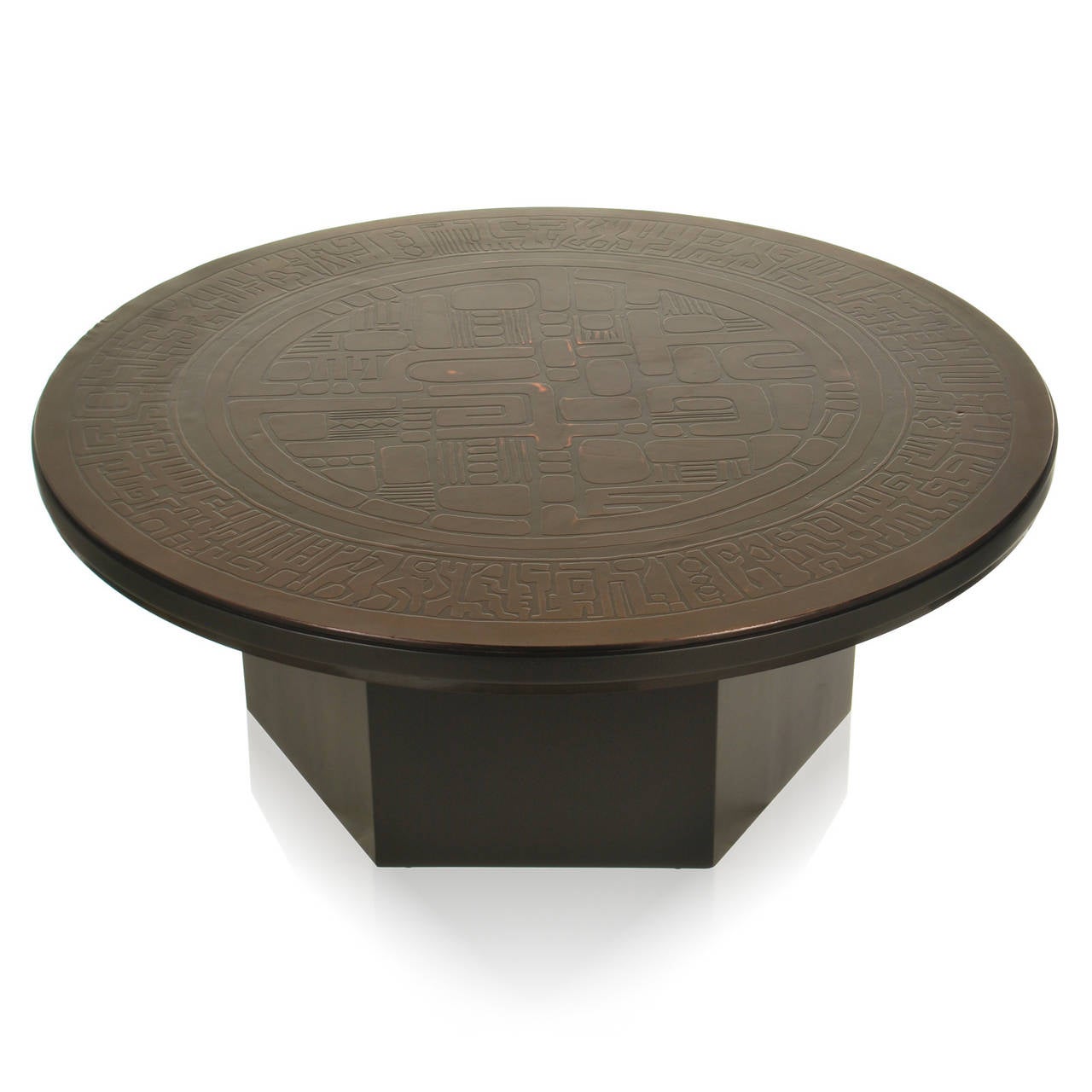This vintage coffee table has a copper relief top with modernist design. Signed Gilbert, the style and look is similar to California and Mexican modern. The center is filled with abstract shapes and forms, which are encircled with modern figures and