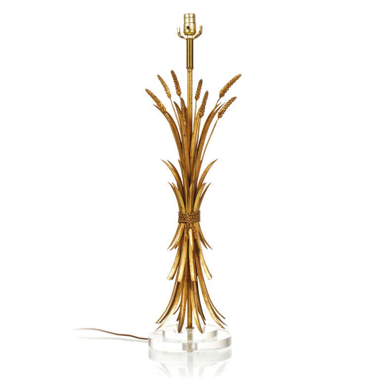This is a superb vintage Italian Sheaf of Wheat table lamp with original gold gilt metal. Its Hollywood Regency look has been further enhanced by a new custom acrylic base, giving it a more clean and modern look and feel. Its large size adds to its