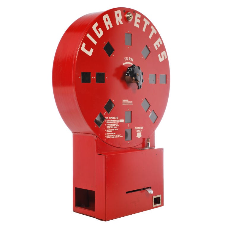 This wall mounted vintage cigarette vending machine has a really cool look with its unique rounded shape and bright red color. Called the Dial A Smoke, you placed a quarter in the slot, turned the black wheel to select the cigarette brand, then