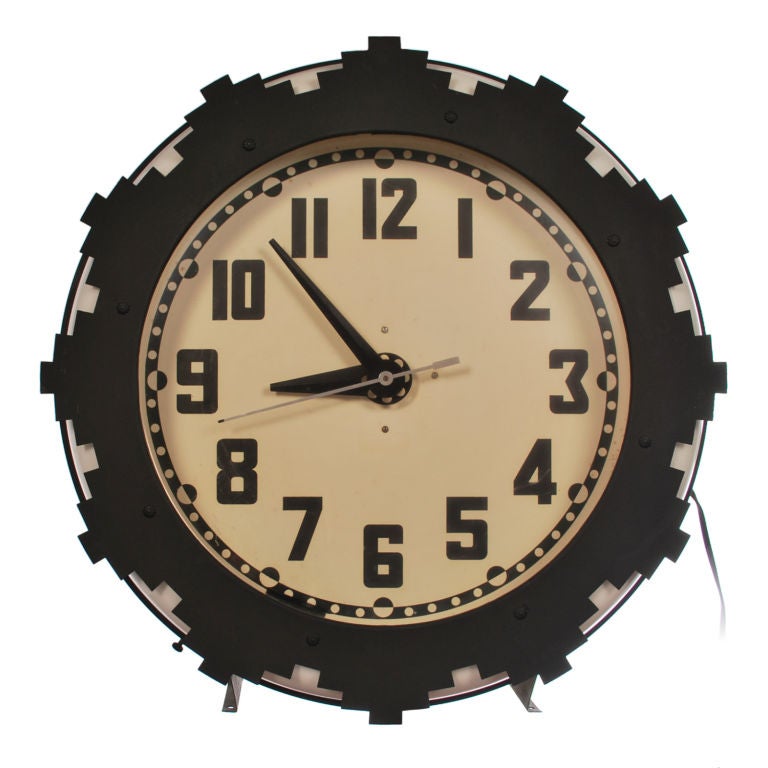 This vintage Art Deco Neon Clock was called the Aztec and was made by the Electric Neon Clock Company in Cleveland Ohio. Once found in diners, gas stations and department stores, this two color neon clock with its distinctive design and iconic look