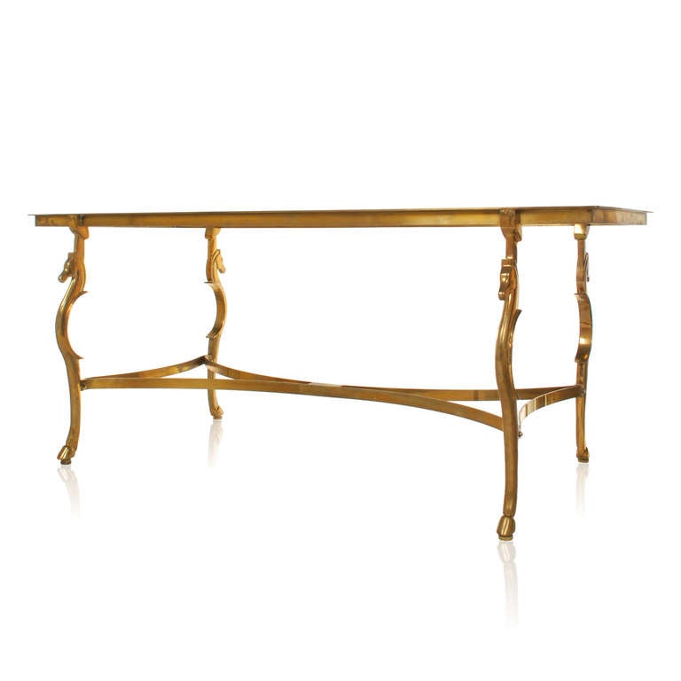 This superbly crafted dining table base has chic and sophisticated look that is reminiscent of Maison Jansen. The base is signed Bennett and dated 81. It's extremely well made and quite substantial. The stylized horse head and leg rest on a