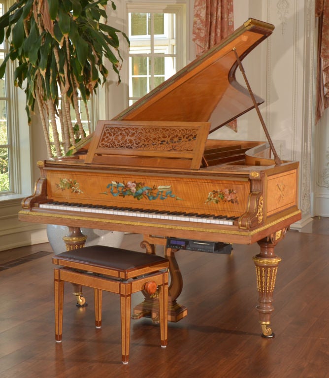 Louis XVI Concert Grand Piano by Erard of Paris, in Satinwood w/mahogany & rosewood banding. Entire case inlaid w/motives of musical instruments & flowers. All parts decorated with gilded ormolu mounts and brass trim. Fall board over keys painted