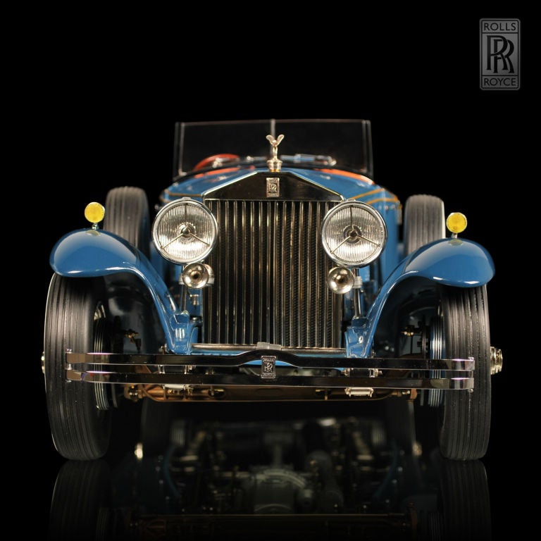 This incredible 1933 Rolls-Royce Phantom II Henley Roadster is a one-off hand built model in 1/8th scale. This is not a kit. The coachwork body is completely scratch built and comes with dual side mount spare wheels. The chrome trim is real, along