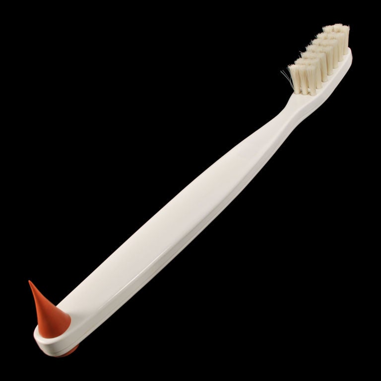 This huge Toothbrush is marked Think Big, NY 1983. This life like over-sized toothbrush has real bristles and a real Gum pick. This would make an excellent Holiday gift for someone in the Dental field. We do have another matching toothbrush, should